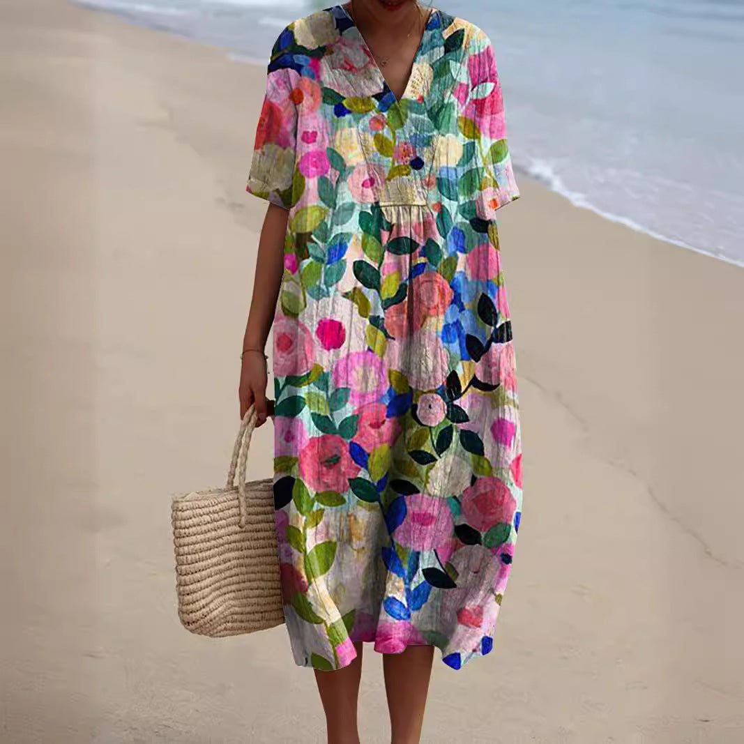 Damen Sommerkleid Talia mit V-Ausschnitt und lebhaftem Blumenmuster. Leicht & bequem für warme Tage.