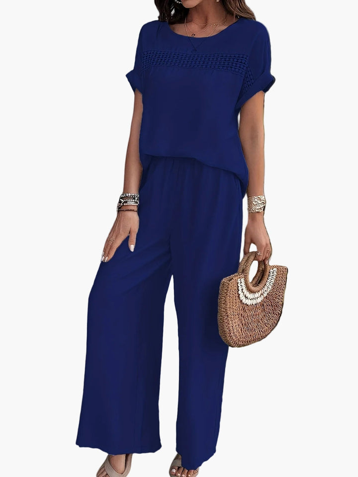 Modischer Damen Jumpsuit für Frühling/Sommer. Eleganter Einteiler mit Häkel-Detail & weiten, luftigen Beinen.