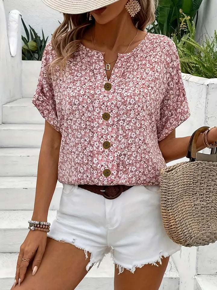 Damen Sommerbluse mit Kurzarm und Knopfleiste, leicht und luftig für warme Tage.