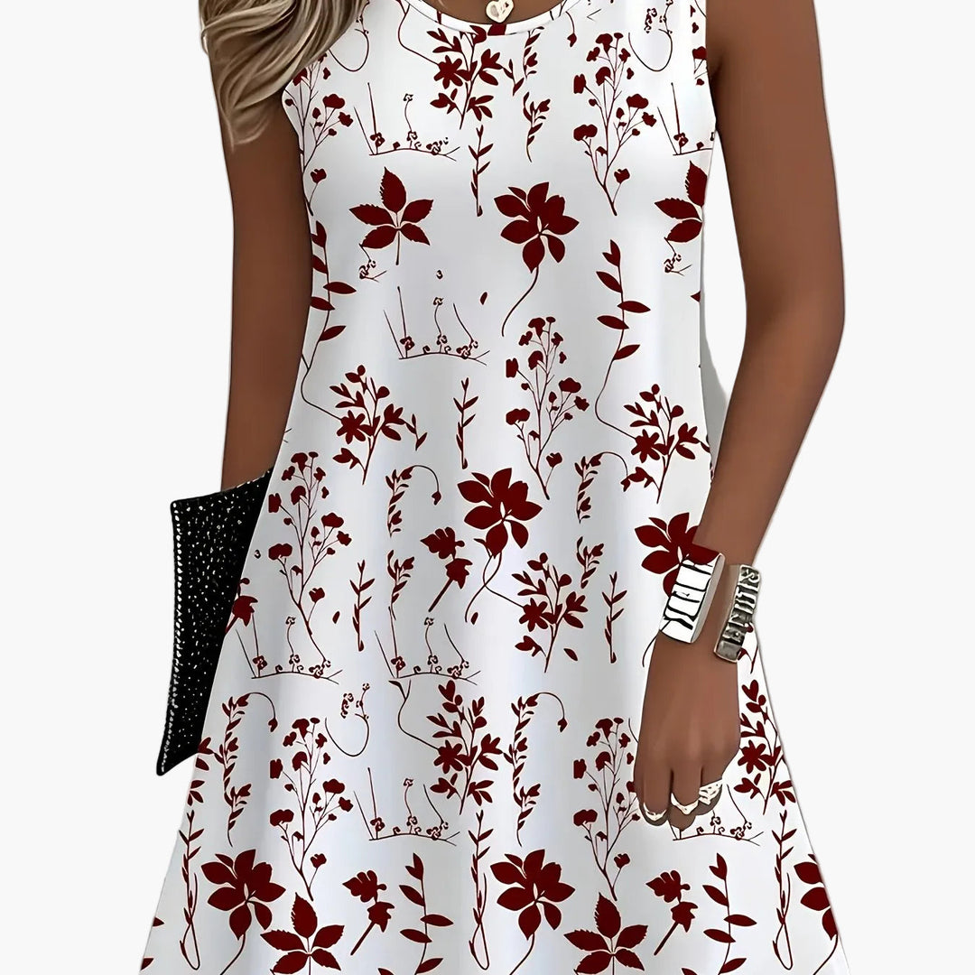 Urlaubskleid Damen mit farbenfrohem Blumenmuster; ärmellos und luftig für warme Sommer.