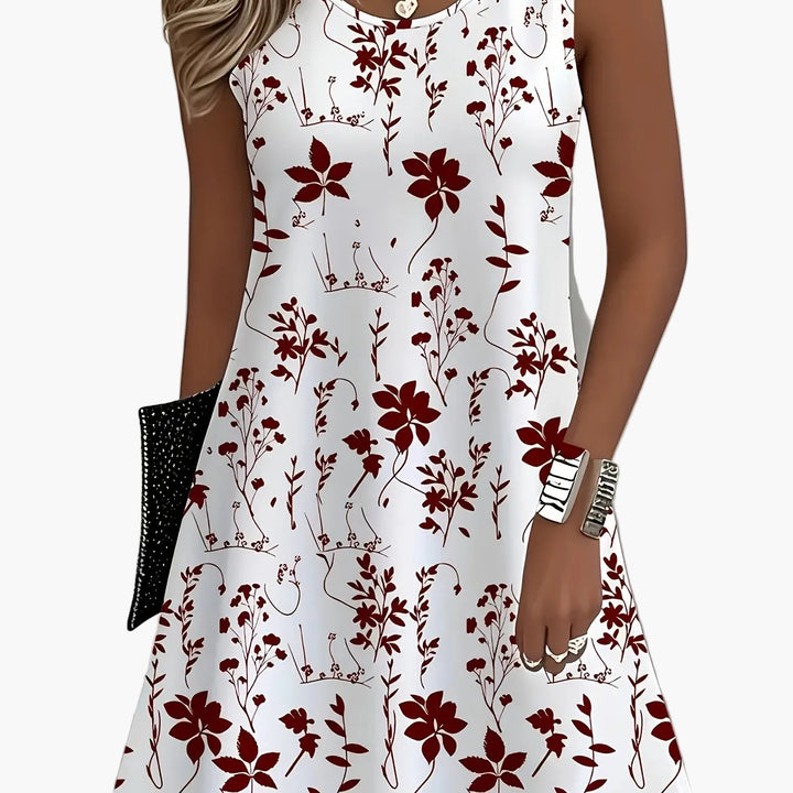 Urlaubskleid Damen mit farbenfrohem Blumenmuster; ärmellos und luftig für warme Sommer.