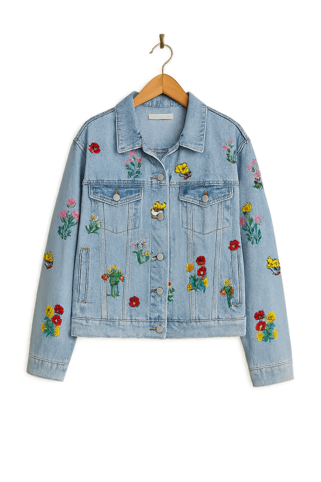 Blaue Damen Jeansjacke im Oversize-Stil mit bunter Blumenstickerei. Ideal als casual Übergangsjacke für junge Mode.