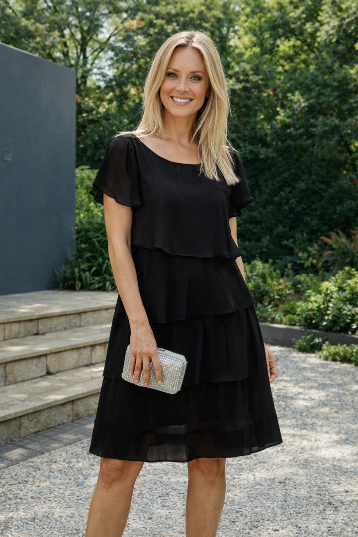 Feminines, knielanges Rüschenkleid für Damen, kurzärmelig und locker, ein stilvolles und bequemes Freizeit-Sommerkleid.