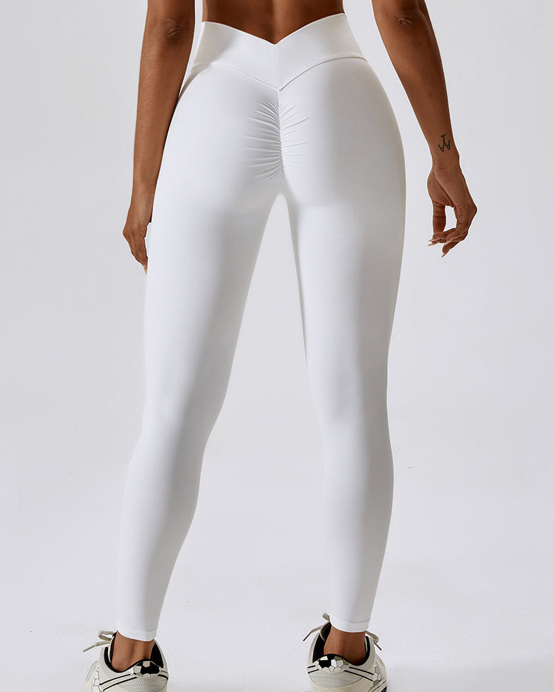 Sportliche Damen Yogahose in Orange-Weiß, hohe Taille. Vielseitige Sporthose für Fitnessstudio & Alltag.