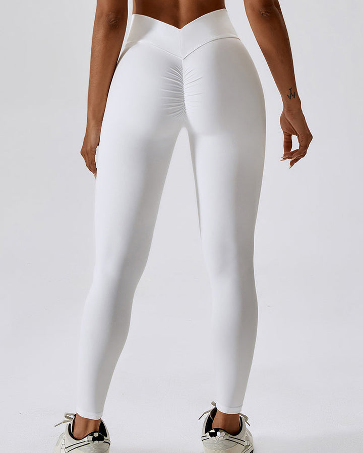 Sportliche Damen Yogahose in Orange-Weiß, hohe Taille. Vielseitige Sporthose für Fitnessstudio & Alltag.