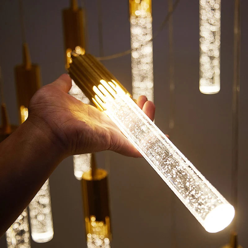 Stilvolle Glas-Zylinderlampe gold/schwarz als moderne Deckenleuchte. Perfekt für warmes und elegantes Wohnambiente.