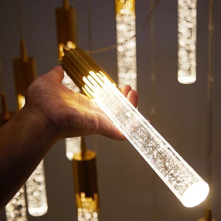 Stilvolle Glas-Zylinderlampe gold/schwarz als moderne Deckenleuchte. Perfekt für warmes und elegantes Wohnambiente.