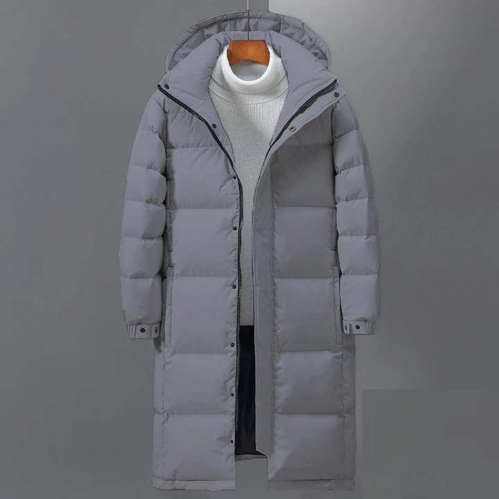 Hochwertiger Herren Steppmantel mit Kapuze. Lange, warme Winterjacke für ultimativen Winterschutz & modernen Stil.