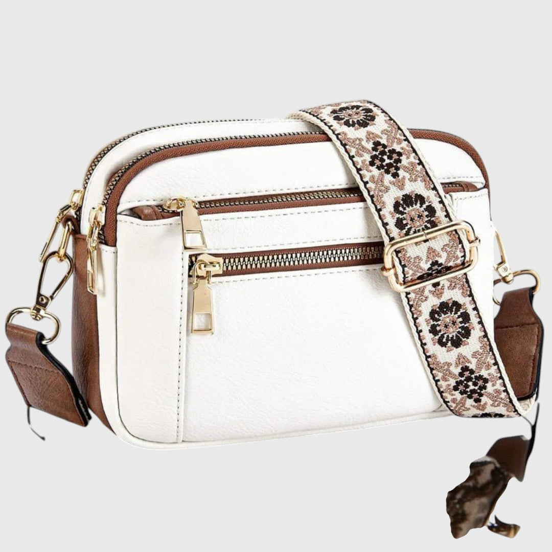 Damen Schultertasche aus Kunstleder mit elegantem Blumenriemen. Modisches Accessoire, praktisch & stilvoll.