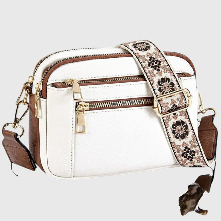 Damen Schultertasche aus Kunstleder mit elegantem Blumenriemen. Modisches Accessoire, praktisch & stilvoll.