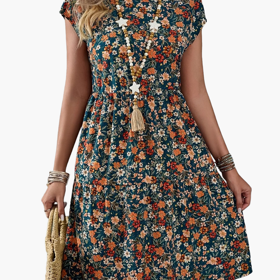 Modisches Damen Blumenkleid, knielang und kurzärmlig. Florales Sommerkleid für Freizeit und Urlaub, feminin.
