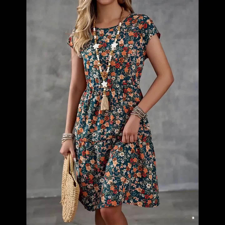 Hübsches Damen Sommerkleid mit floralem Design. Knielanges Kurzarmkleid, perfekt als Freizeit- oder Urlaubskleid.