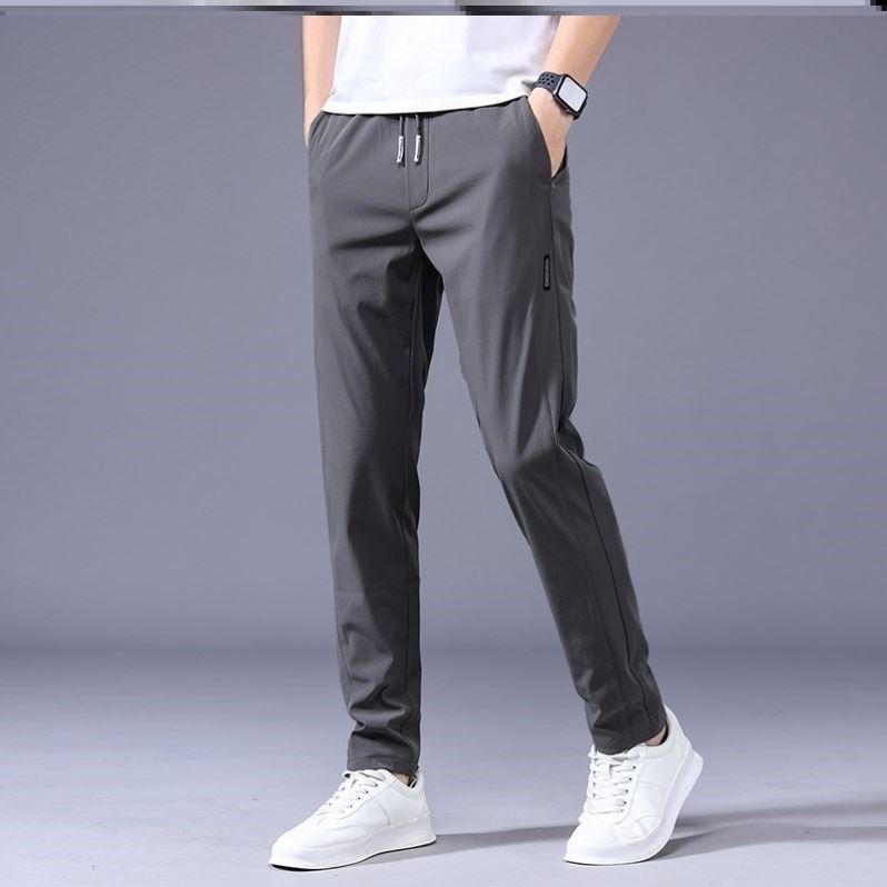 Lockere Unisex Freizeithose in Grau mit Kordelzug, ideal für Athleisure-Looks und Komfort.