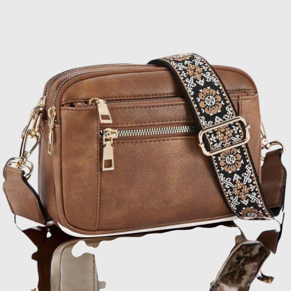 Elegante Damen Crossbody-Tasche aus hochwertigem Kunstleder mit stilvollem Blumenriemen. Praktisch für jeden Anlass.