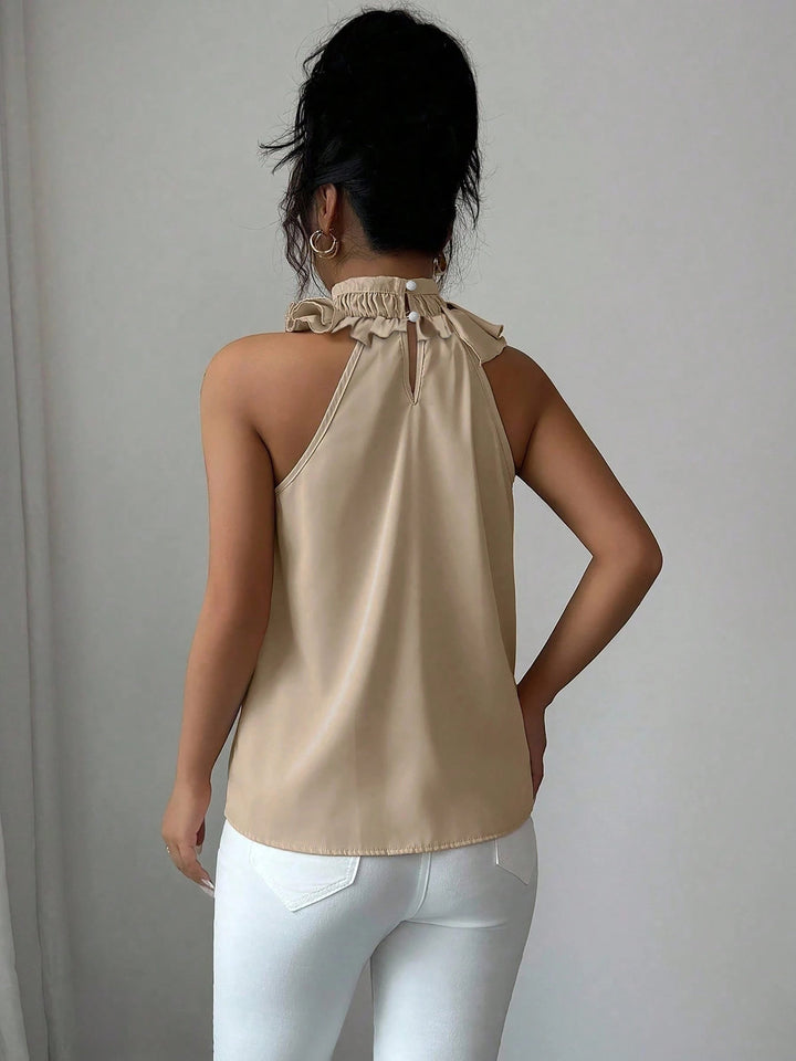 Damen Oberteil: Ärmellose Rüschenbluse mit elegantem Stehkragen, perfekt für Frühling & Sommer.