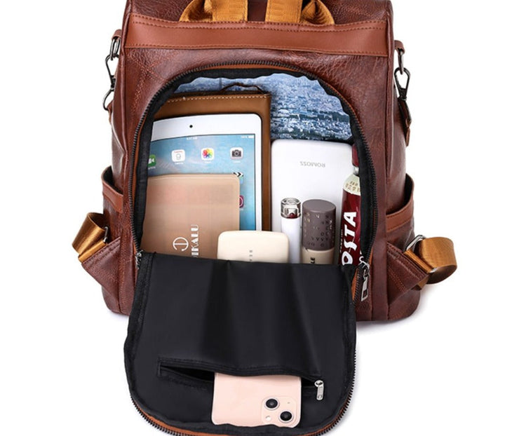 Praktischer & eleganter Reise-Rucksack für Damen, aus veganem Leder in stilvoller Braun-Optik.