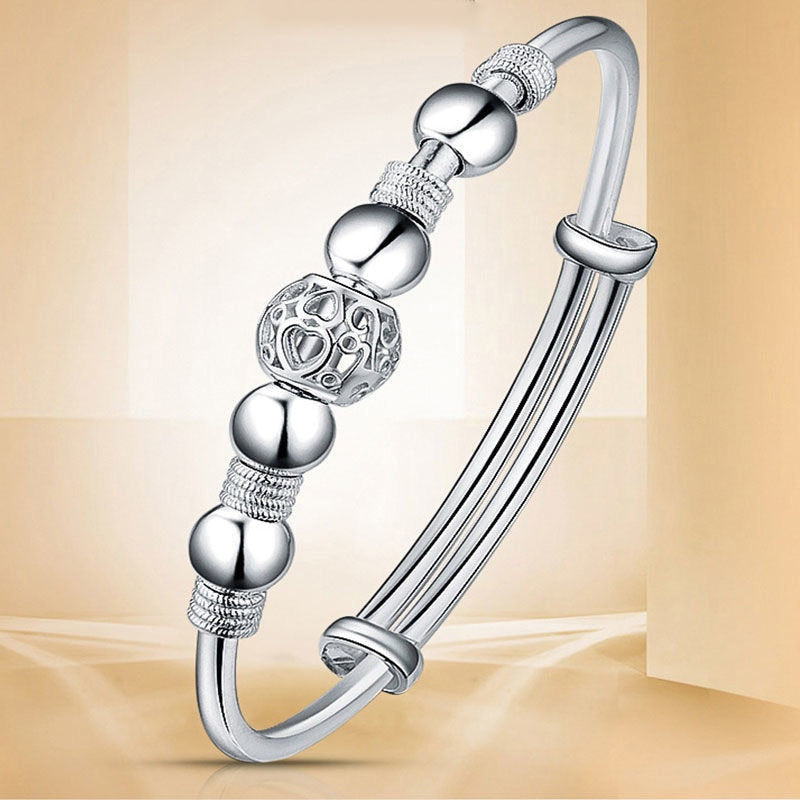 Elegantes Damen Silberarmband, 925er Sterlingsilber mit polierten Glücksperlen. Zeitloser Schmuck für Frauen.