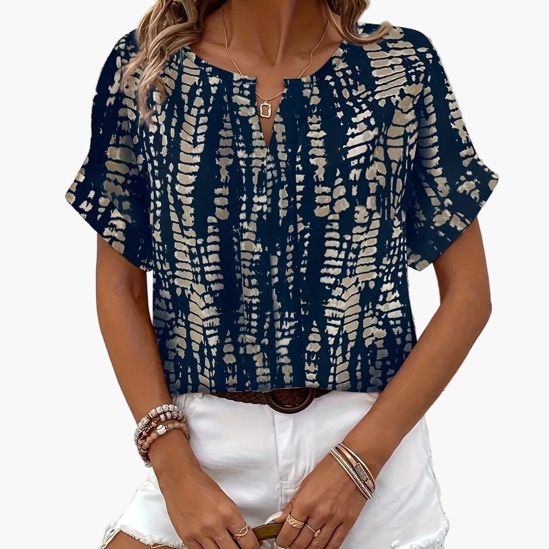 Damen Kurzarmbluse, elegant mit modernem Muster. Ideal für sommerliche Anlässe.