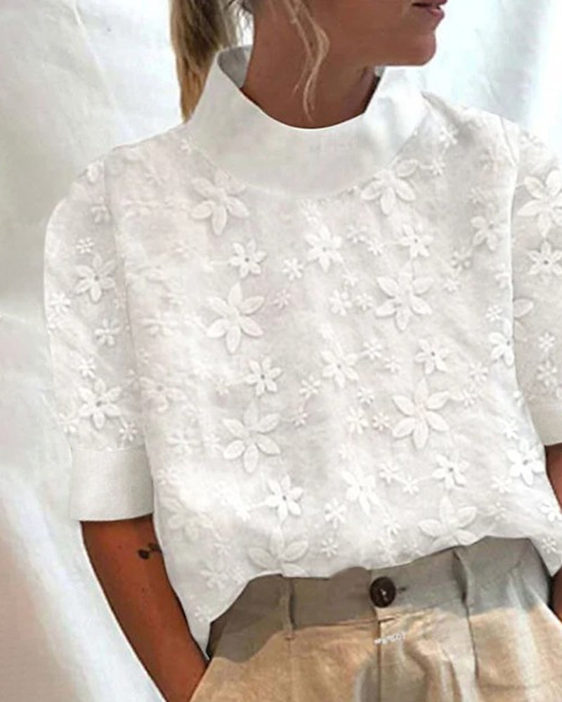 Elegante Damen Bluse mit hohem Kragen und farbigem Blumenmuster, ideal für Büro und Freizeit.