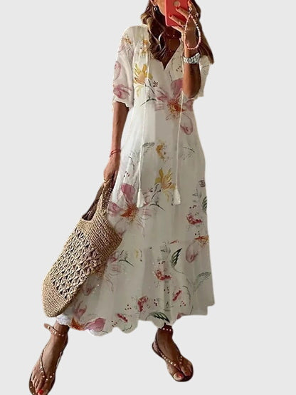 Vielseitiges Damen Freizeitkleid, A-Linie, V-Ausschnitt, leichtes Material und Blumenmuster. Perfekt für den Sommer.
