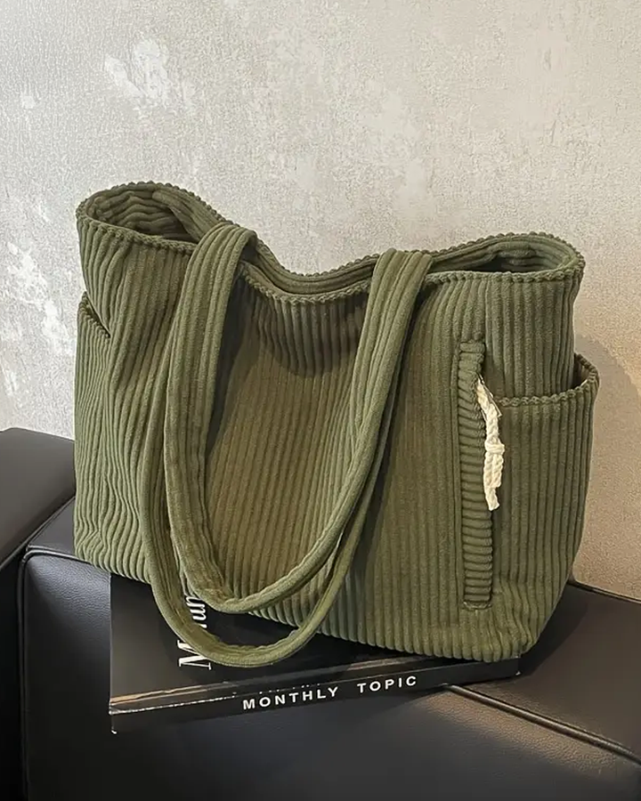Gerippte Cord-Damentragetasche mit modischem Kordelzug. Vielseitige Umhängetasche für Alltag und Büro.