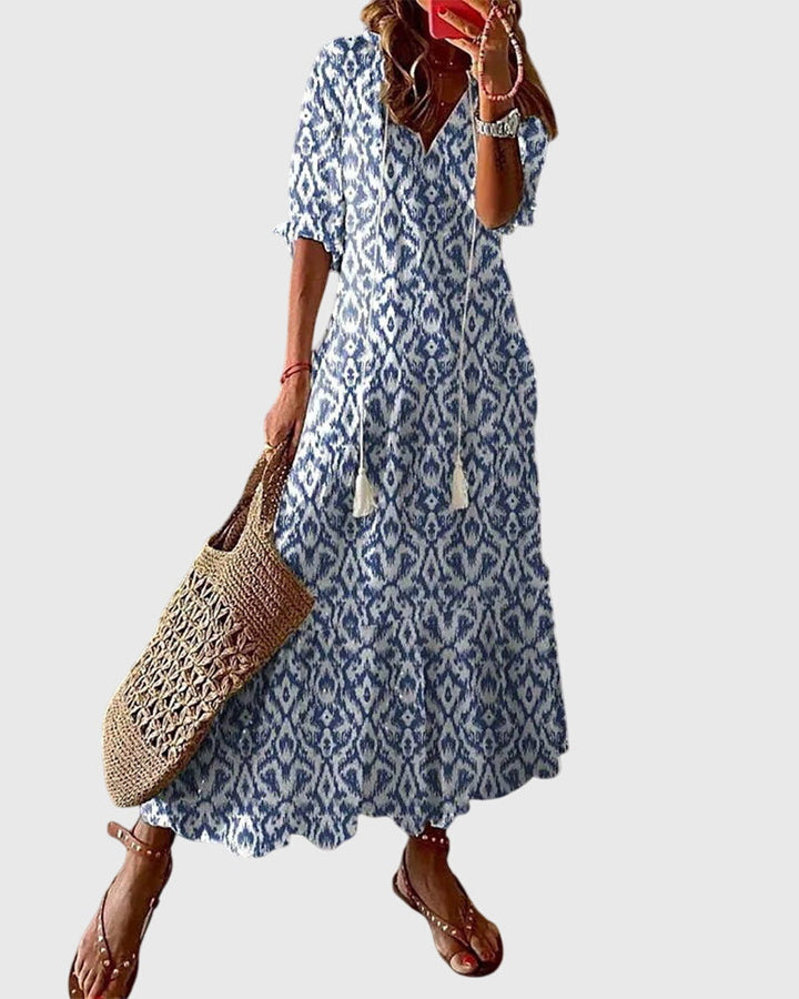Damen Boho Sommerkleid mit Vintage Blumenmuster, A-Linie & V-Ausschnitt. Ideal als leichtes Freizeitkleid.