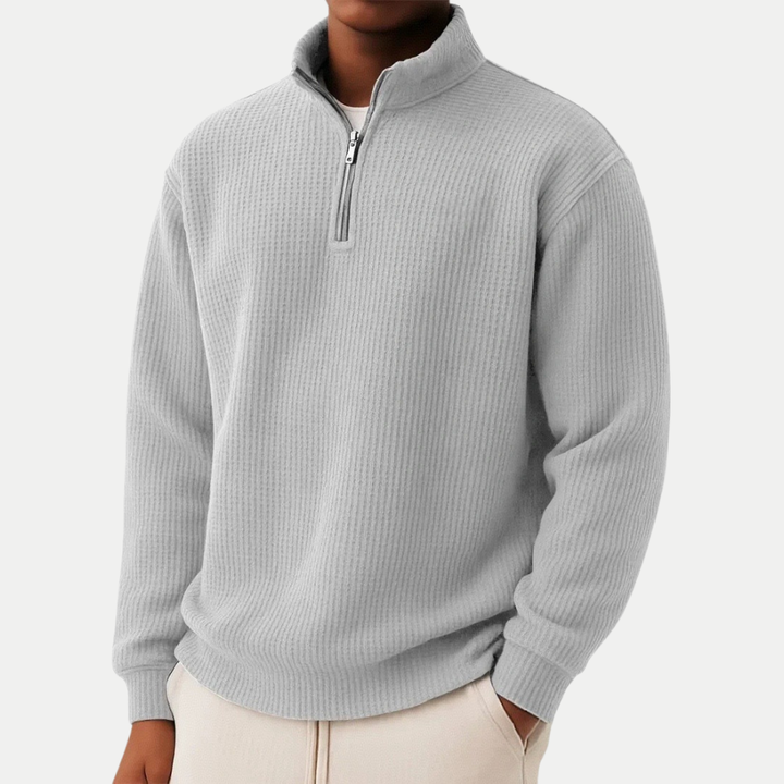 Zeitloser Herren Pullover mit Stehkragen, Langarm und praktischem Front-Reißverschluss.