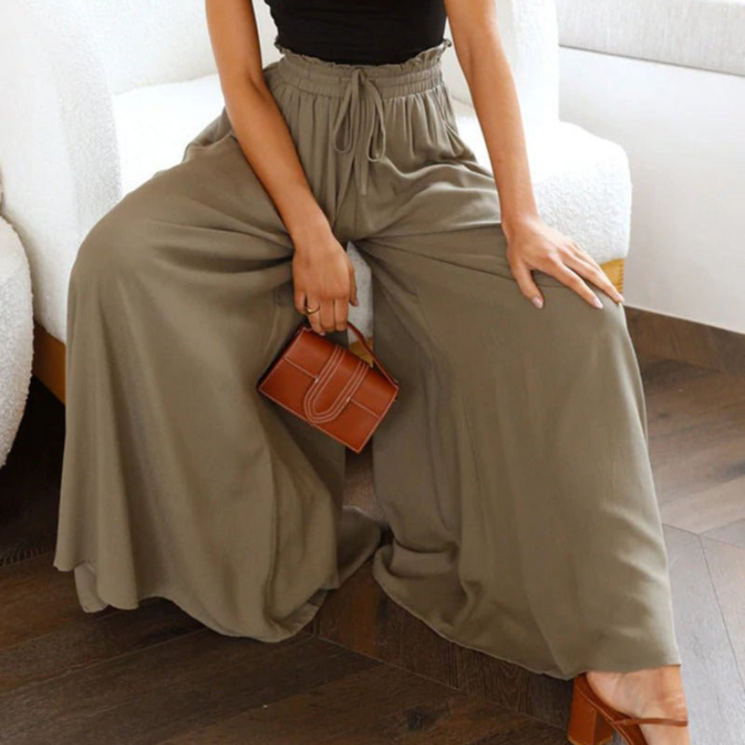 Luftige Damen Sommerhose mit Kordelzug und hoher Taille, bequem und stilvoll für heiße Tage.