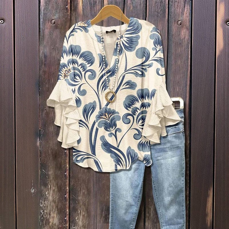 Modische Damen-Langarmbluse mit zartem Blumenprint & charmanten Rüschenärmeln. Ideal für frühlingshafte Looks.
