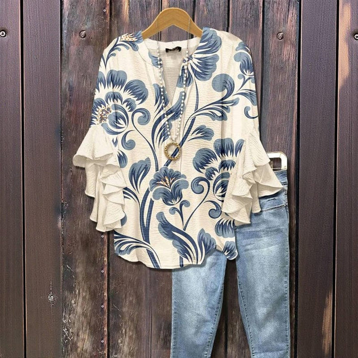 Modische Damen-Langarmbluse mit zartem Blumenprint & charmanten Rüschenärmeln. Ideal für frühlingshafte Looks.