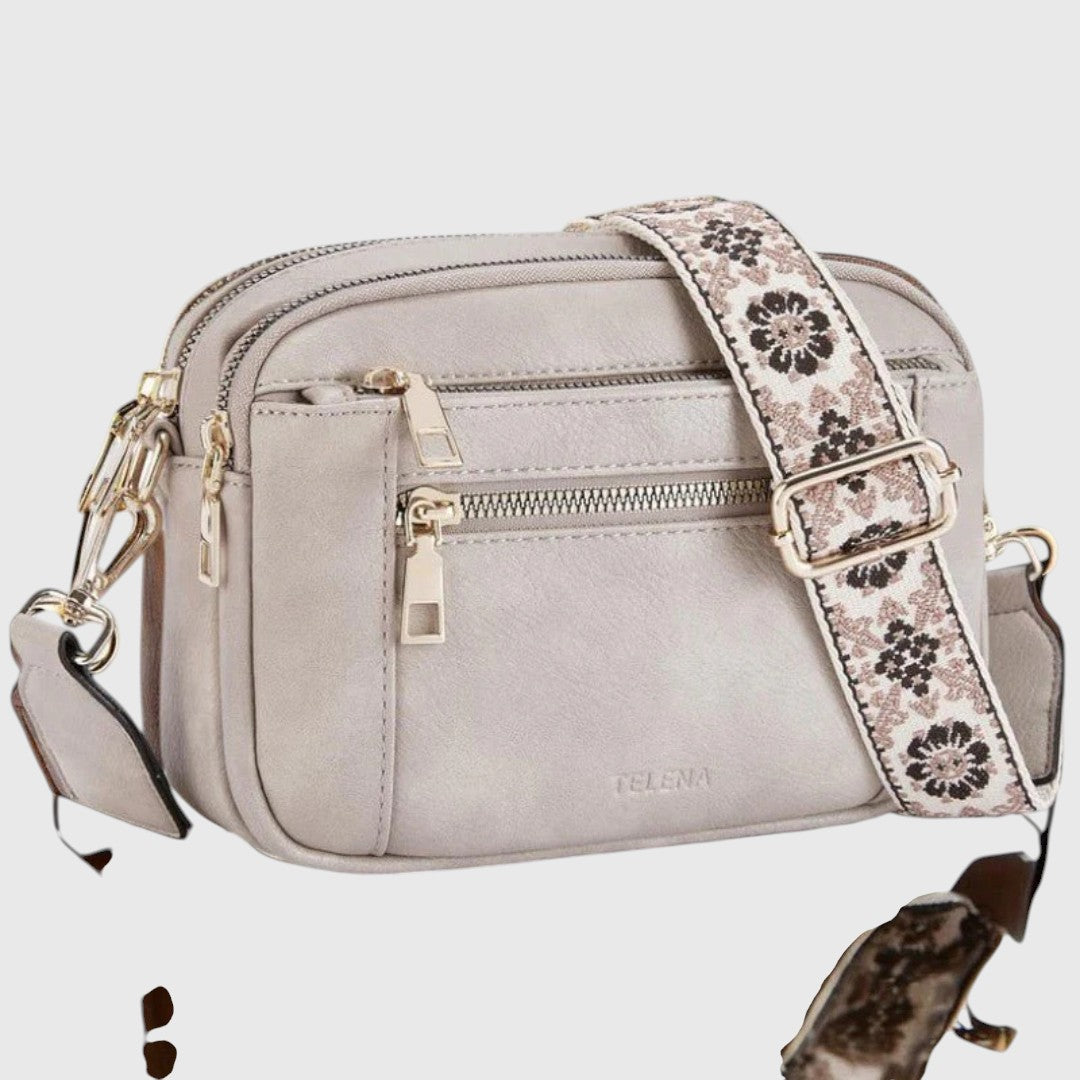 Praktische Damen Crossbody-Tasche aus Kunstleder mit verstellbarem Blumenriemen. Elegant, vielseitig & modisch.