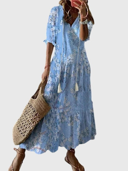 Fließendes Damen Boho Maxikleid mit Blumenmuster und V-Ausschnitt, ideal für sommerliche Tage.