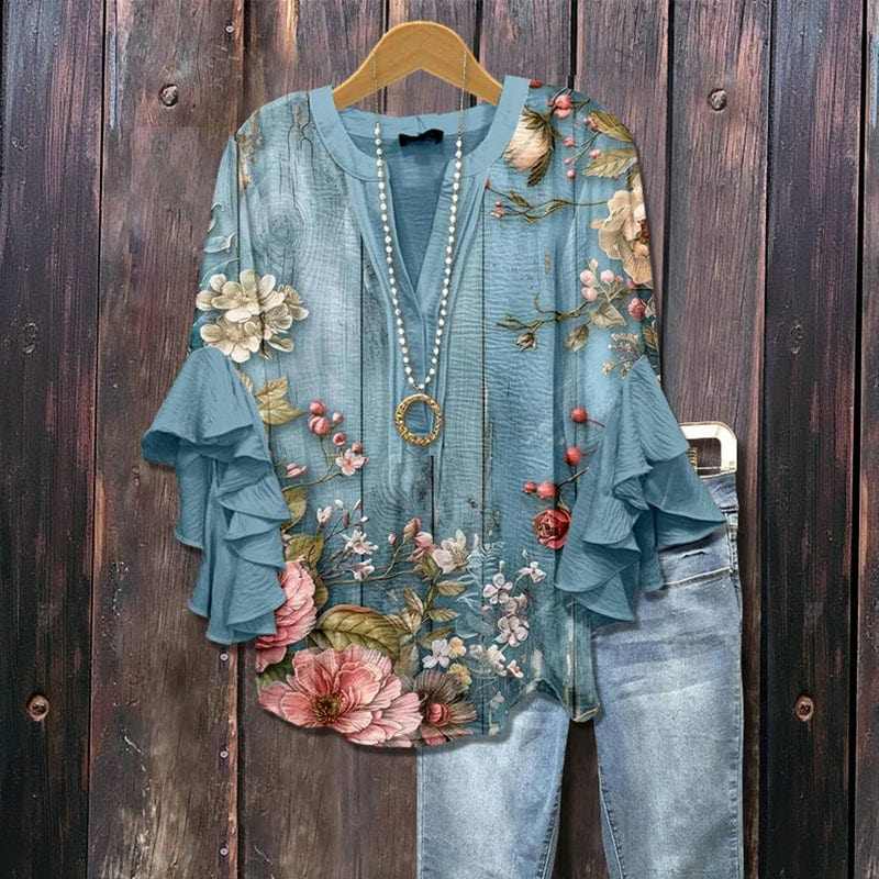 Stilvolle Damenbluse mit Blumenprint und eleganten Rüschenärmeln. Eine schicke Freizeitbluse für die wärmere Jahreszeit.