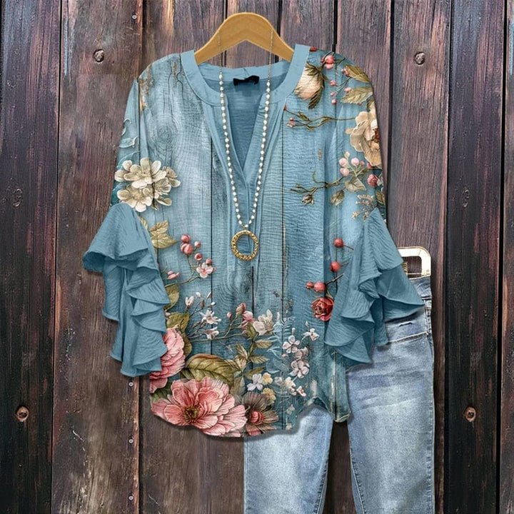 Stilvolle Damenbluse mit Blumenprint und eleganten Rüschenärmeln. Eine schicke Freizeitbluse für die wärmere Jahreszeit.