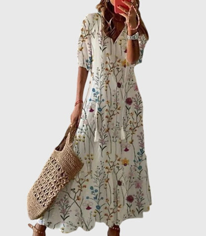 Urlaubstaugliches Damen Sommerkleid: Luftiges Boho Maxikleid mit floralem Print und elegantem V-Ausschnitt.