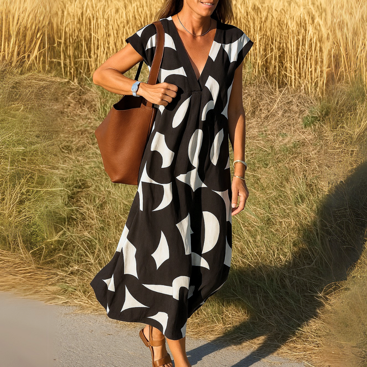 Stilvolles Damen Sommerkleid mit V-Ausschnitt, leichtem Stoff, ideal für Frühling & Sommer. Elegant und bequem.