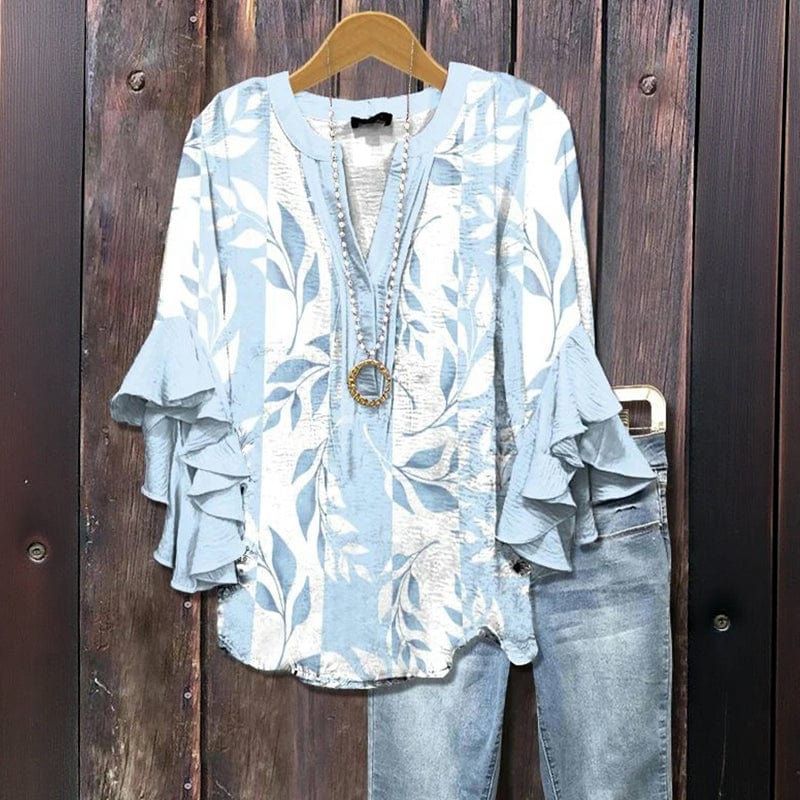 Elegante Damenbluse mit Blumenmuster und verspielten Rüschenärmeln. Eine modische Langarmbluse für Freizeit.