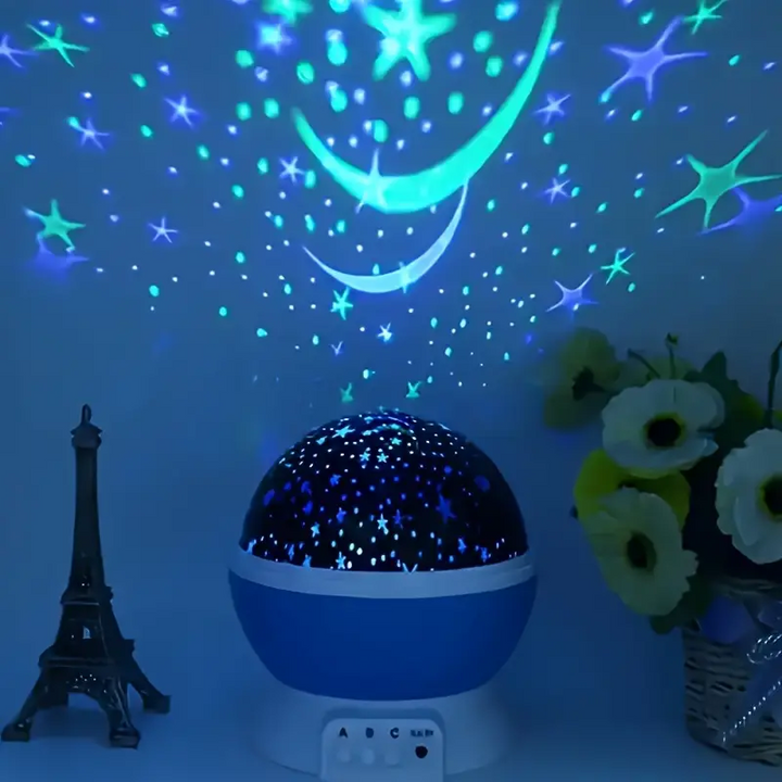 LED Sternenprojektor Nachtlicht für Kinder, projiziert blaue und rosa Sterne an die Decke im Babyzimmer.