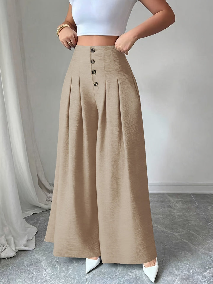 Komfortable Businesshose für Damen, Weitbein, High-Waist, stilvoll mit Falten & Knopfdetail.