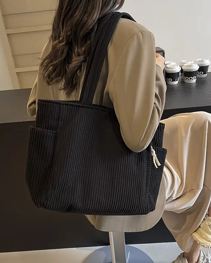 Praktische gerippte Damen Tasche mit Kordel-Detail. Ideal als geräumige Alltagstasche und modisches Statement.