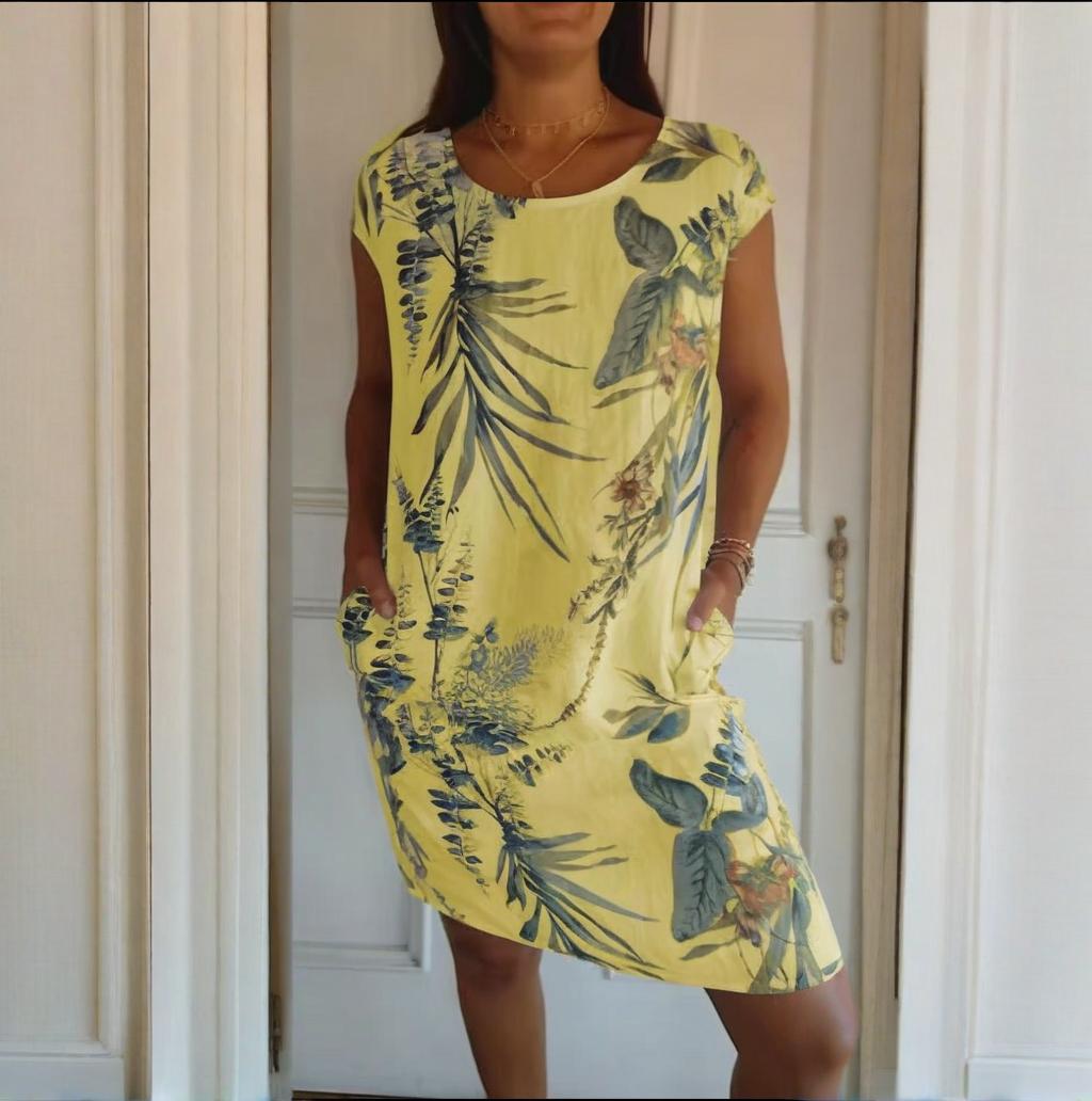 Bequemes Damen Freizeitkleid, botanisch bedruckt, mit Rundhals und zwei Taschen, perfekt für warme Tage.