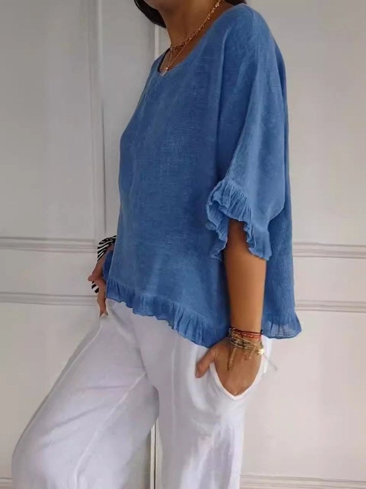 Modische Damen Rüschenbluse in Loose Fit mit Rundhals. Ideal für Casual und elegante Outfits im Sommer und Frühling.