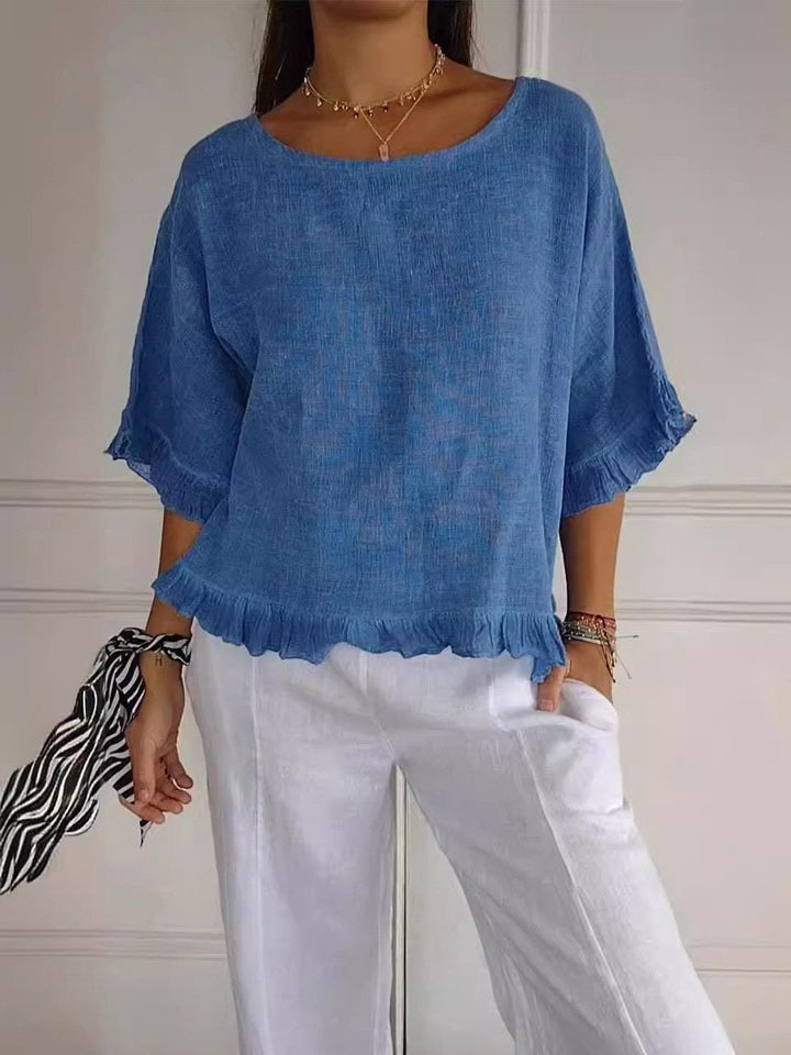 Elegante Damen Bluse mit Rüschen und Rundhals, 3/4-Arm. Perfekt für Büro, Freizeit und feminine Frühlingslooks.