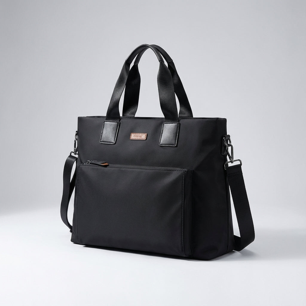 Professionelle schwarze Businesstasche für Laptops, perfekt organisiert für Büro & Reisen, als Schultertasche tragbar.