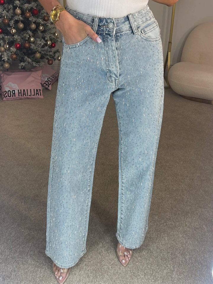 Glitzernde Damen-Schlagjeans in Blau, hoher Bund und schmeichelhafter Schnitt für einen femininen Look.