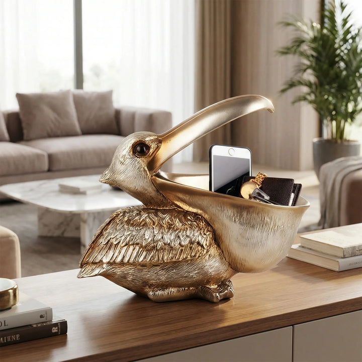 Dekorative Pelikanfigur in Gold-Optik mit Ablageschale, ideal als Schlüsselablage & Schreibtisch-Organizer.