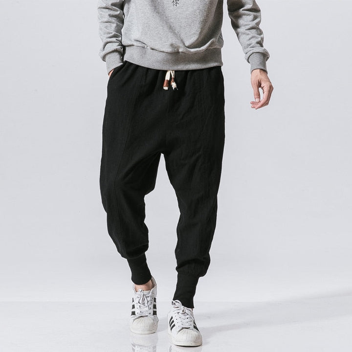 Herren Haremshose, lässige Streetwear Trainingshose in Schwarz, locker geschnitten für Komfort.
