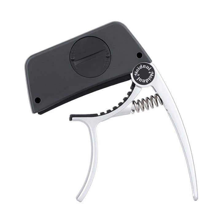 Vielseitiger 2-in-1 Capo & Stimmgerät für Gitarre, Bass und Ukulele. Chromatisches Tuning präzise und schnell.