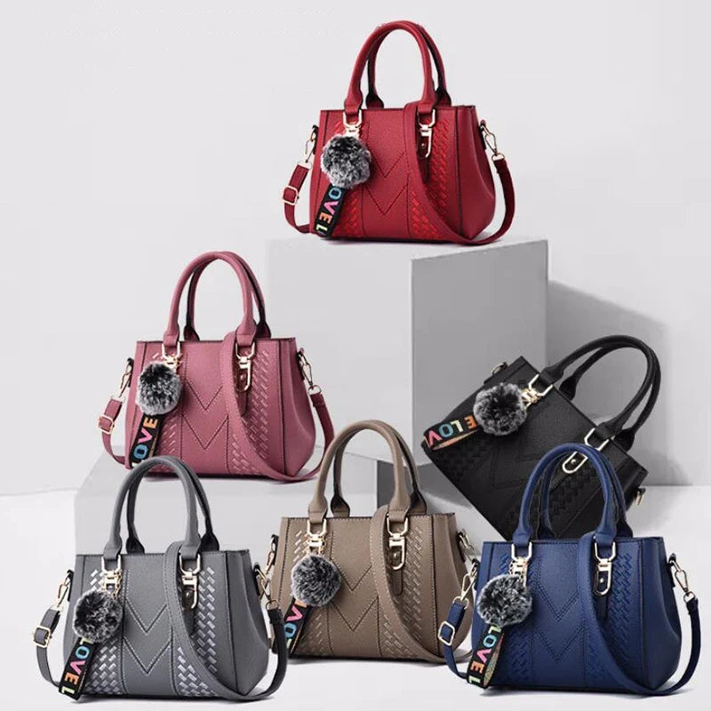 Hochwertige dunkelblaue Leder Handtasche für Damen mit dezenter Stickerei; chic und praktisch.