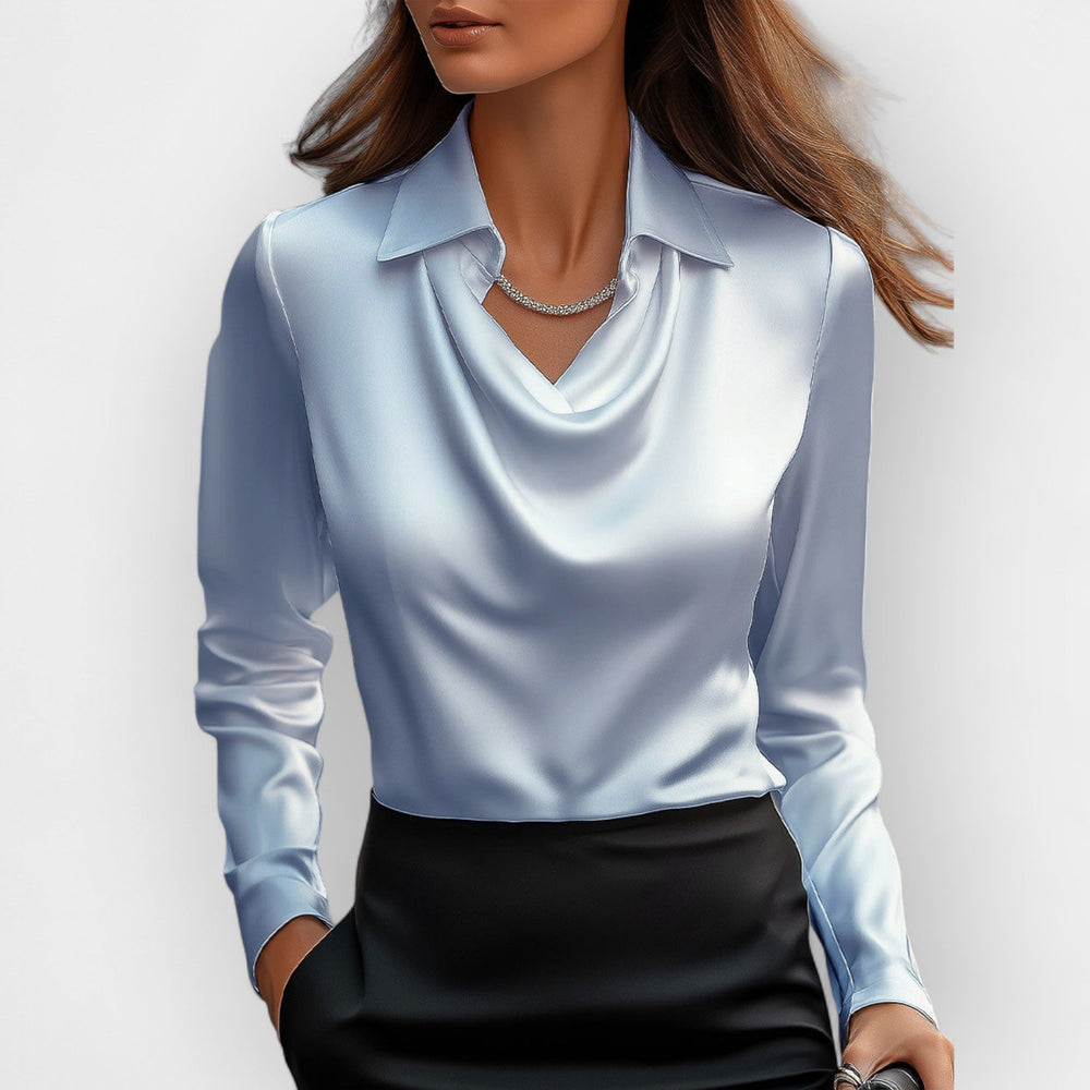Klassische Damenbluse mit stilvollem Wasserfallkragen. Perfekt für den eleganten Businesslook.